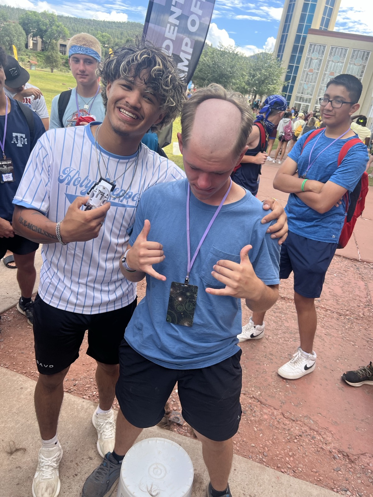 Caleb mid-haircut with a friar tuck bald spot